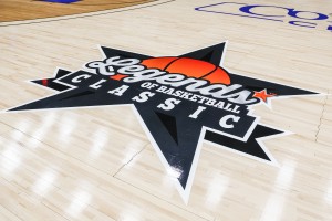 A close-up of the Legends of Basketball Classic logo on a basketball court